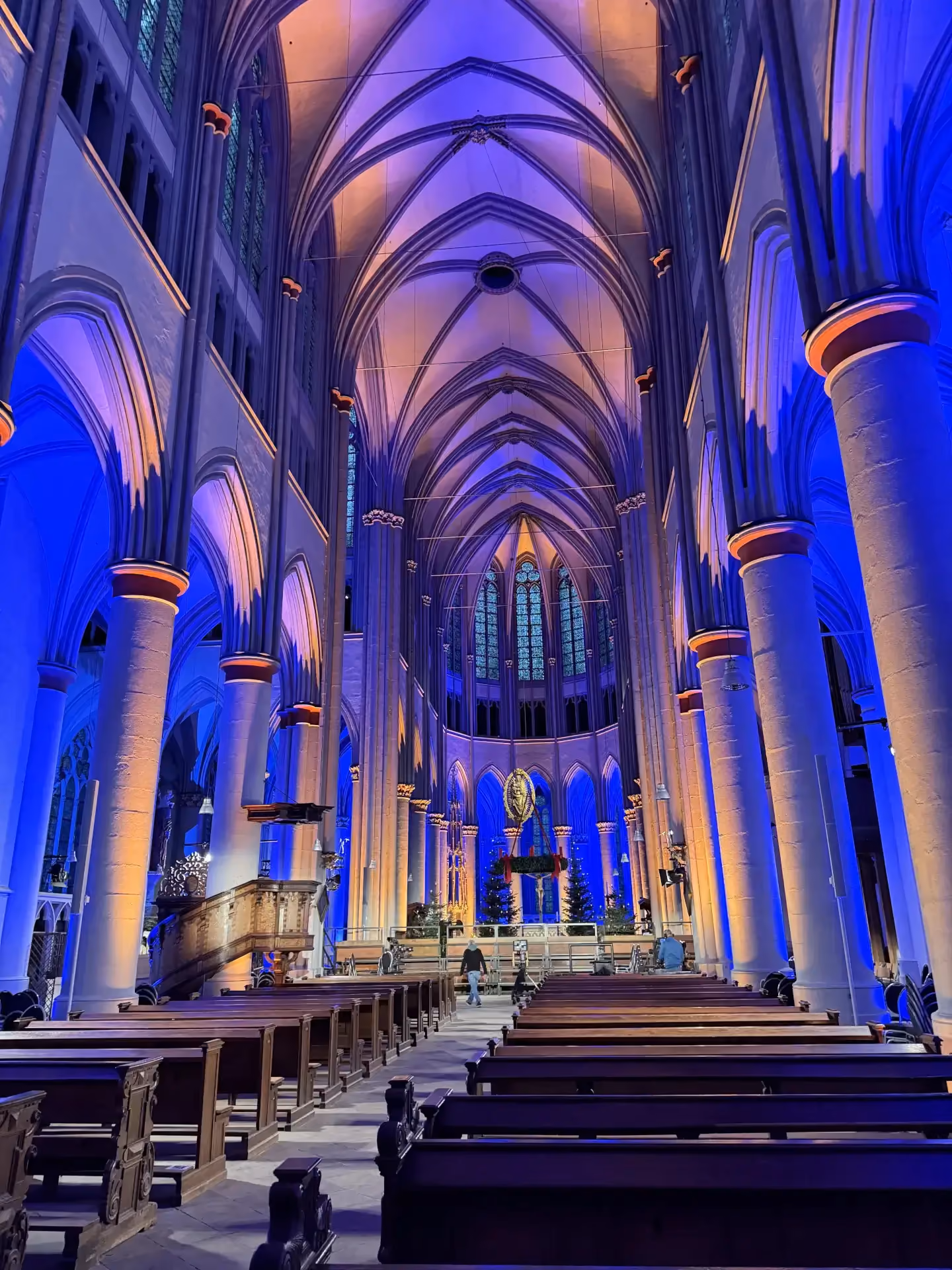 Altenberg Cathedral illuminated in blue and amber, portrait format, by photon