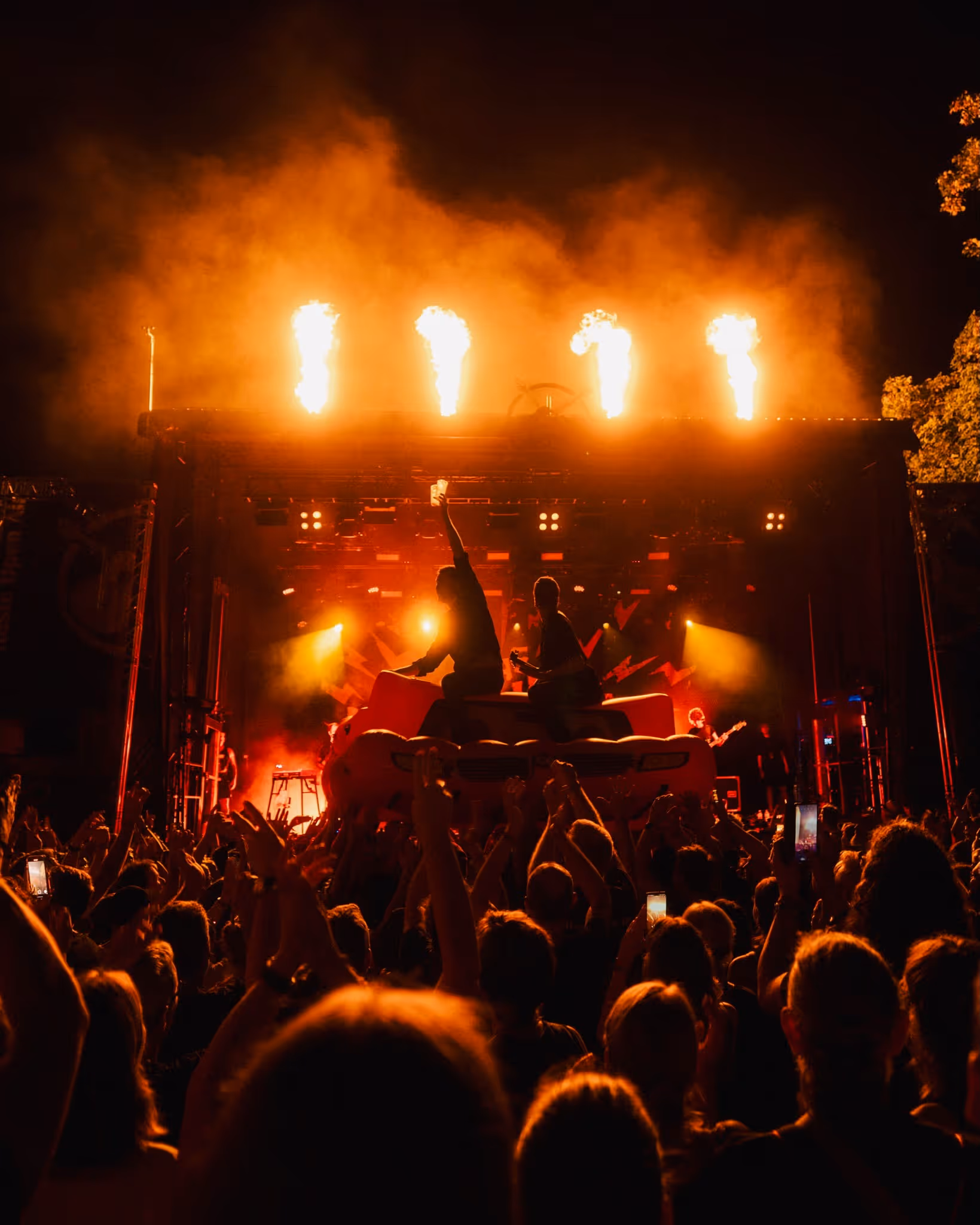 Open-air concert with flame effects and cheering crowd – festival production by photon