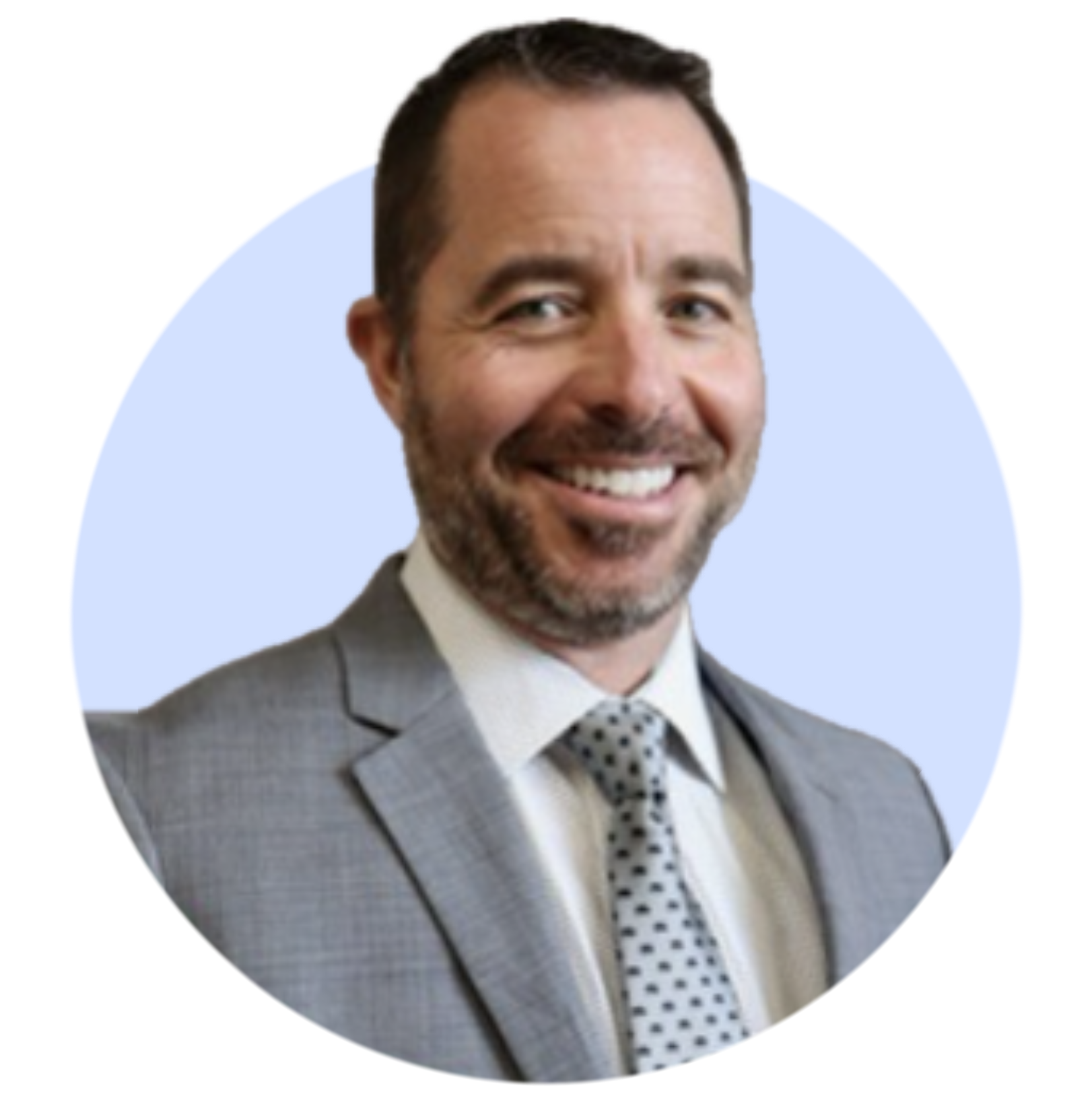 Smiling man with short dark hair and beard wearing a gray suit and dotted tie on a light blue circular background.