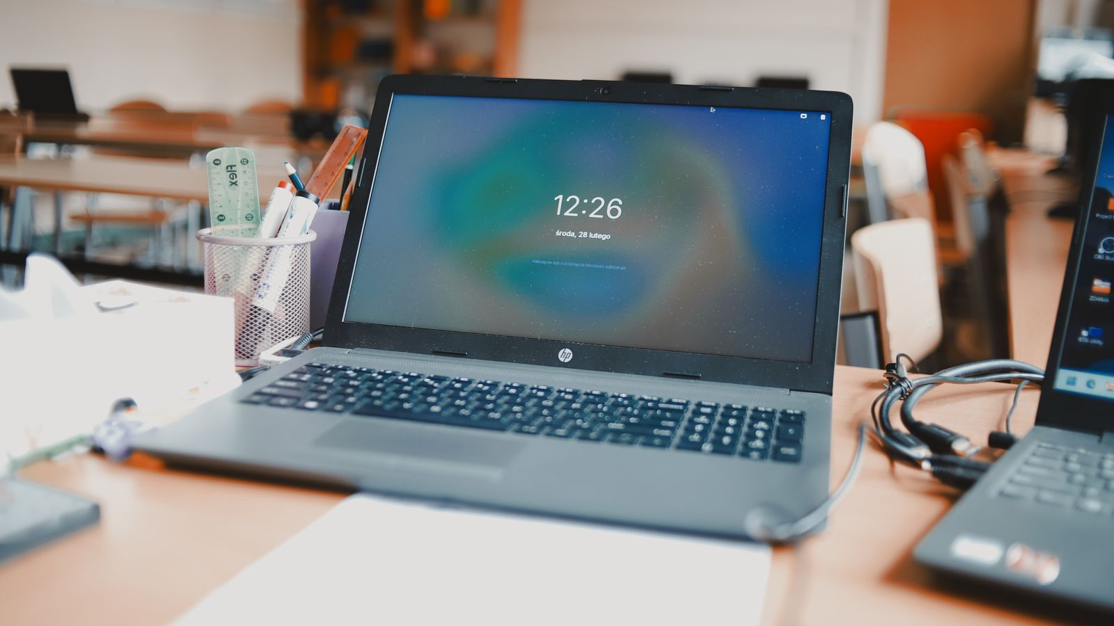 Laptops on desks in a K-12 classroom