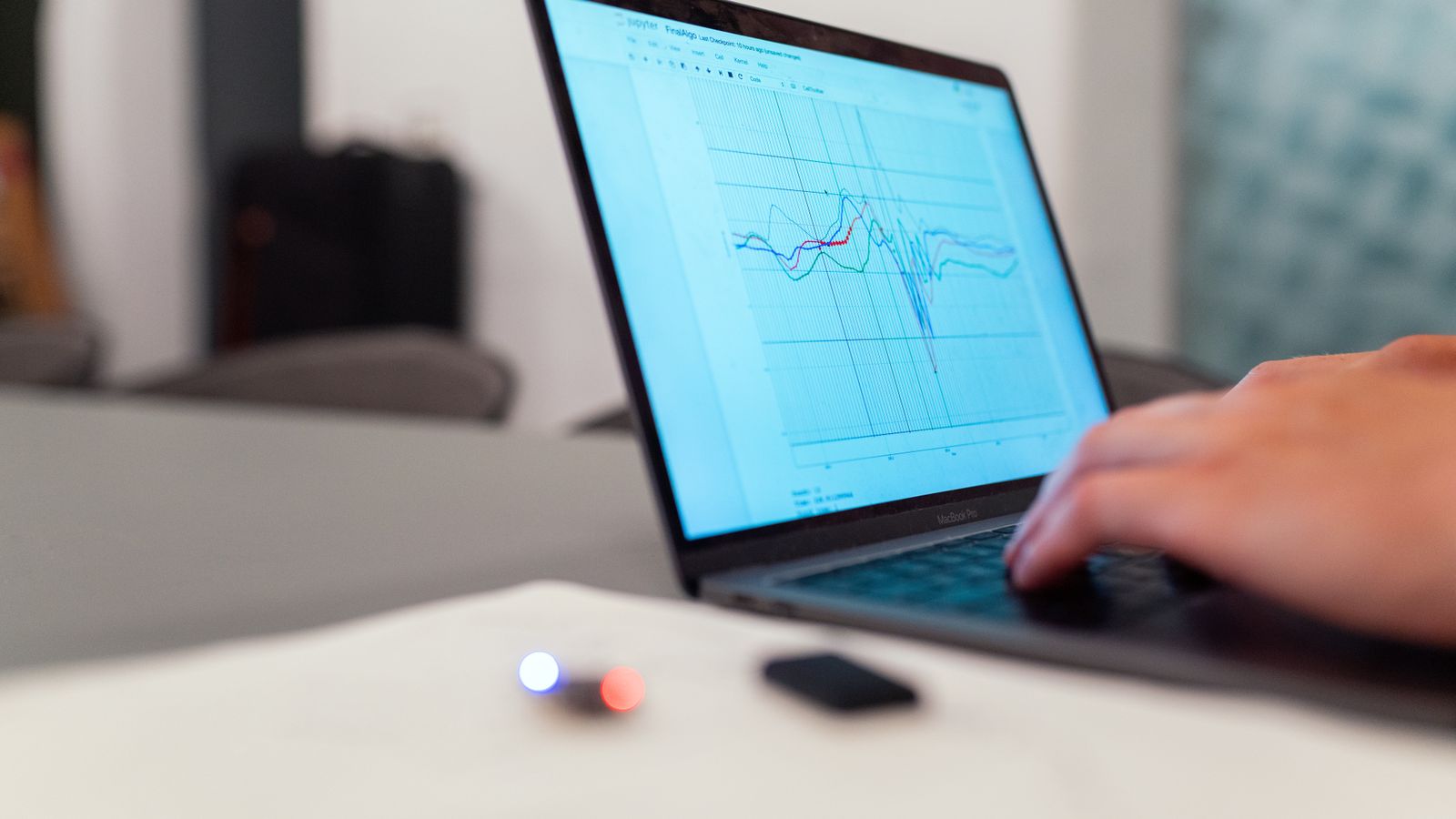 Reviewing phishing simulation performance data on a laptop