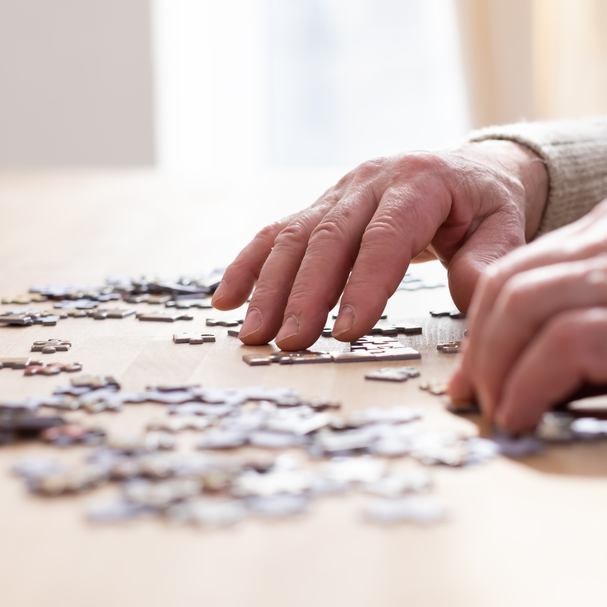 elderly person doing a puzzle