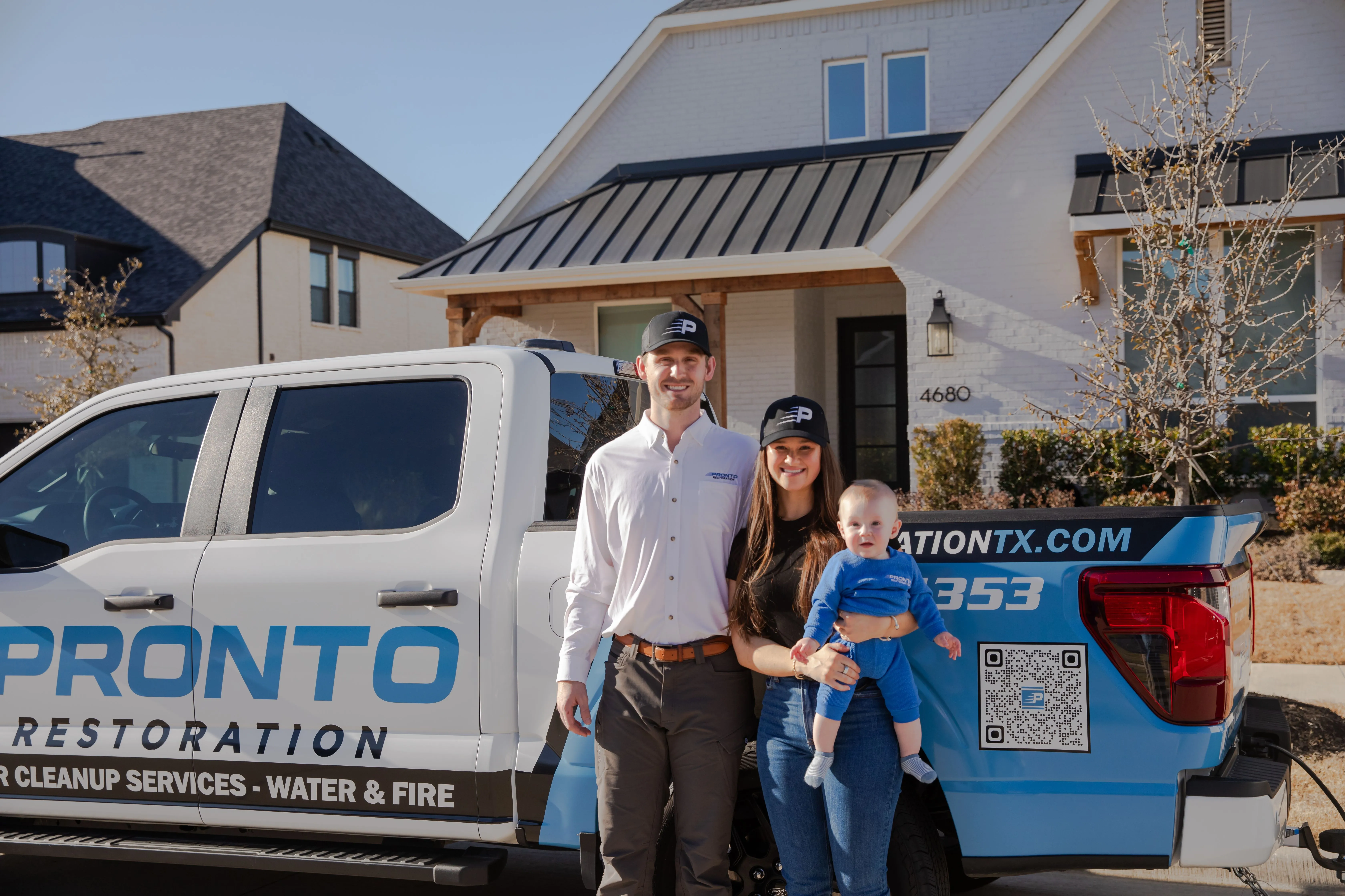 Cooper Chandler and his family beside their Pronto Restoration truck