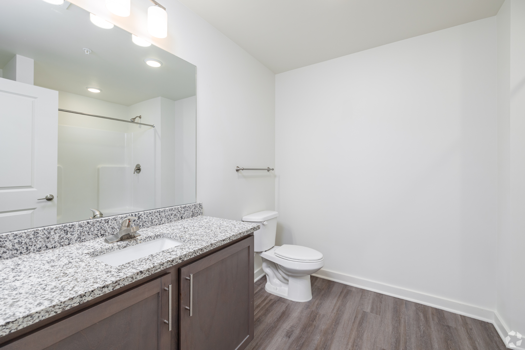 Bathroom with vanity and shower tub combo