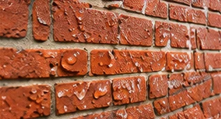 Water beading on waterproofed chimney brick