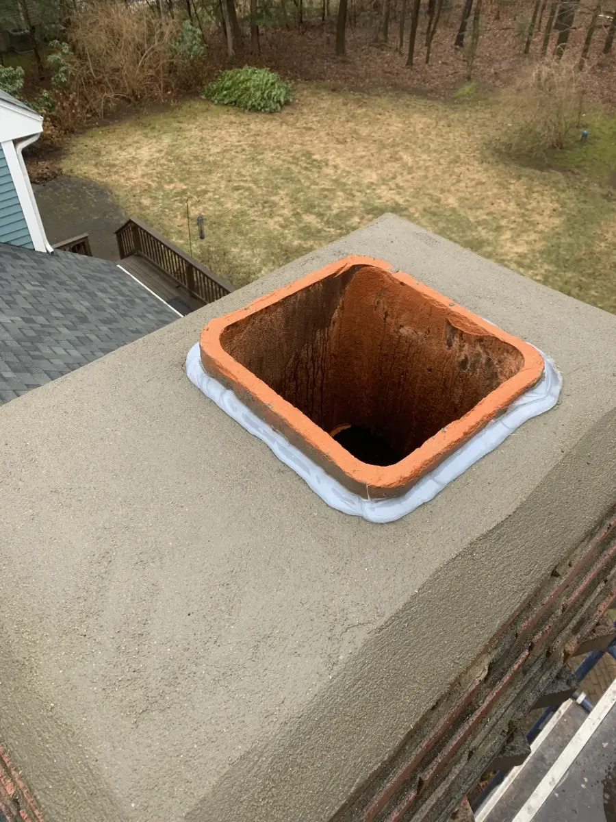 Newly built chimney crown with the flue tile sealed
