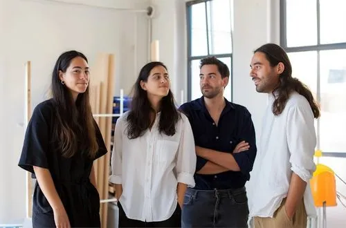 A group of people standing next to each other.