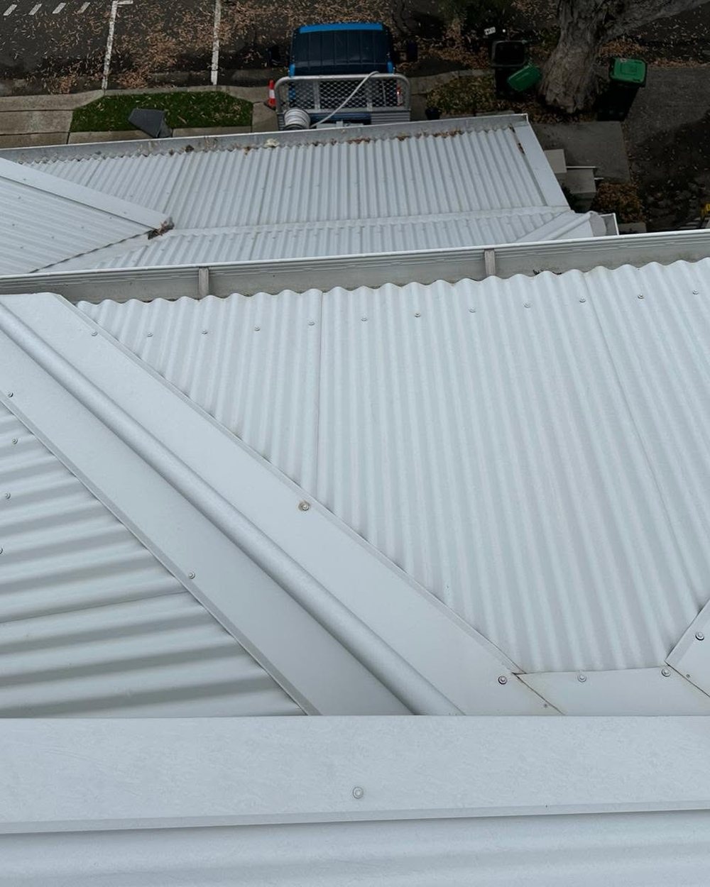 The same Sydney metal roof after soft washing, with the streaking removed and the coating intact.