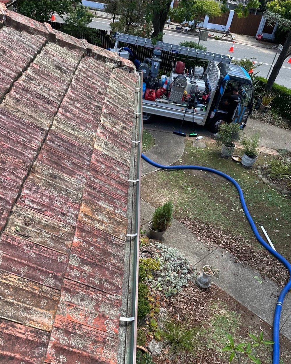 The same gutter run cleared back to bare metal after vacuum gutter cleaning.