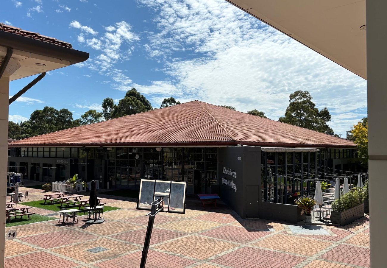 Clean terracotta tiled roof on a Sydney commercial building after professional roof cleaning.