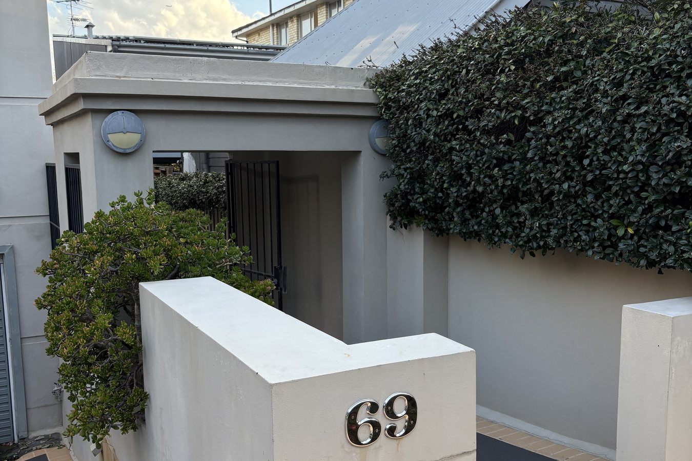 Clean rendered entry and paving of a Sydney property presented ready for sale.