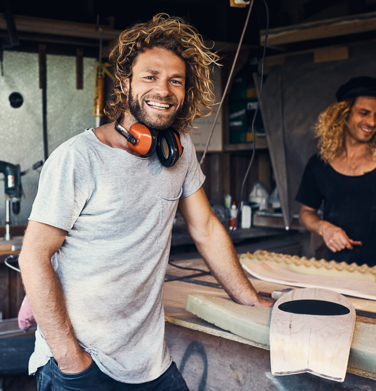 Carpenter in studio, smiling at camera