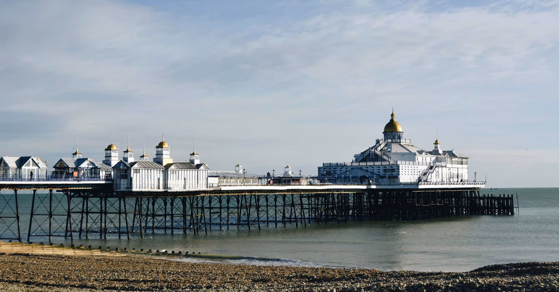 Eastbourne pier with shingle beach in foreground