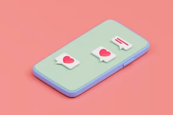 Smartphone mit Herz-Symbolen und Kommentar-Icons auf pastelgrünem Hintergrund