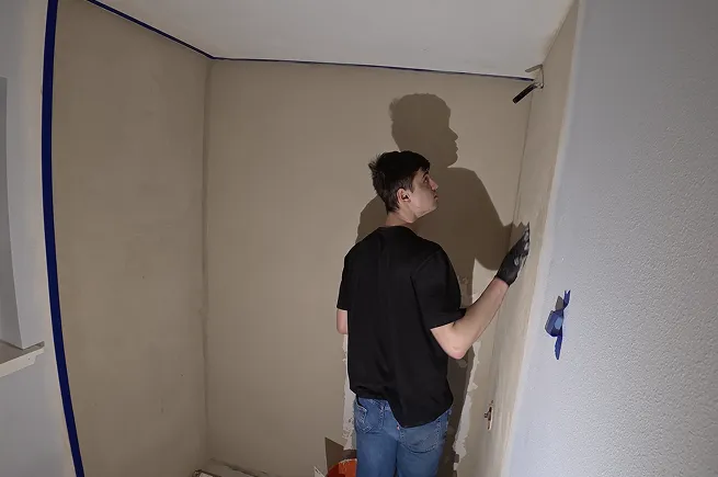 First coats of microcement going onto the shower walls