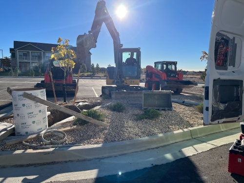 Excavator and construction equipment at work in urban development site