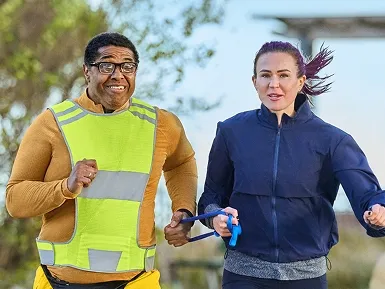 Michael and Theresa running outside together.
