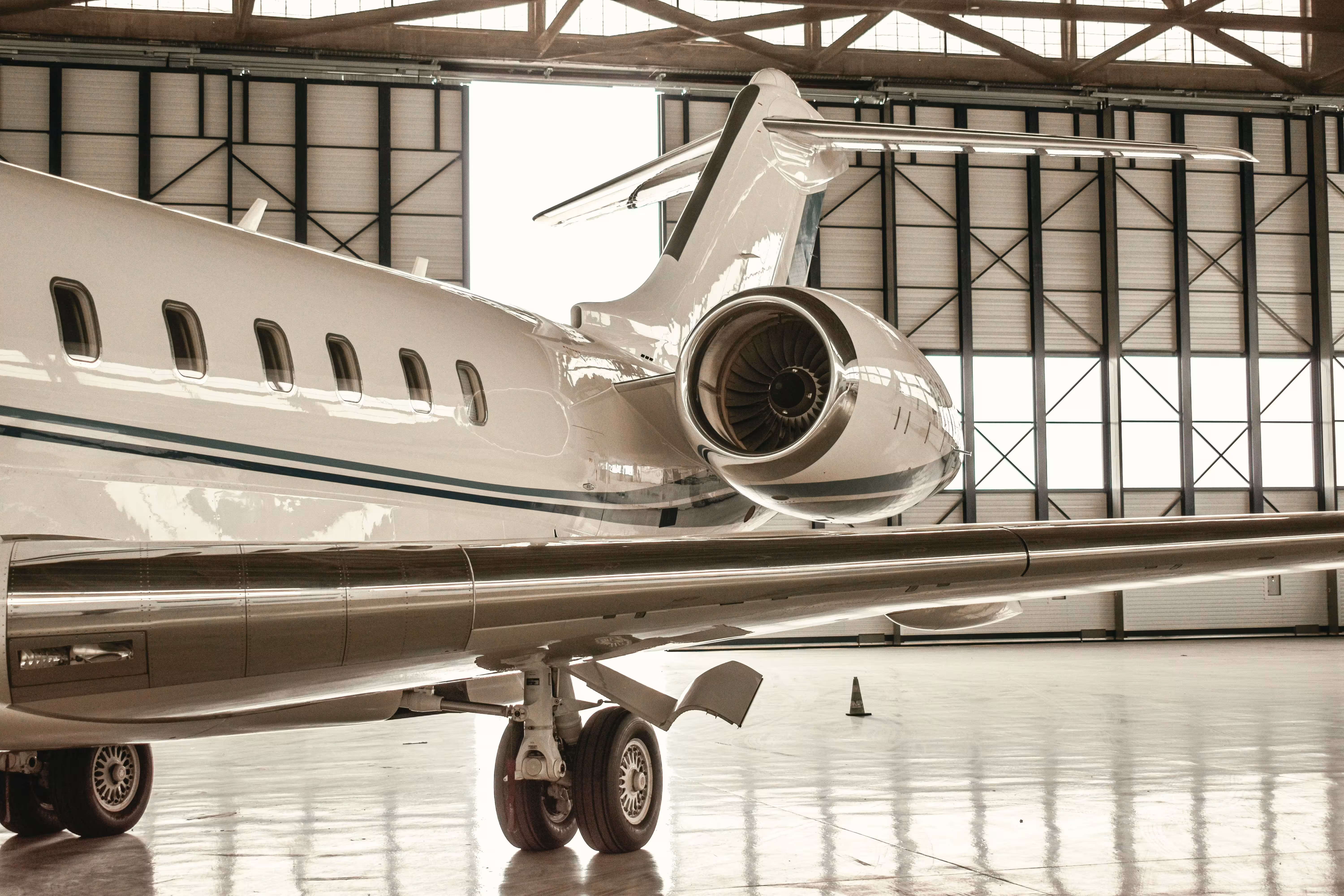 Business jet parked in hangar