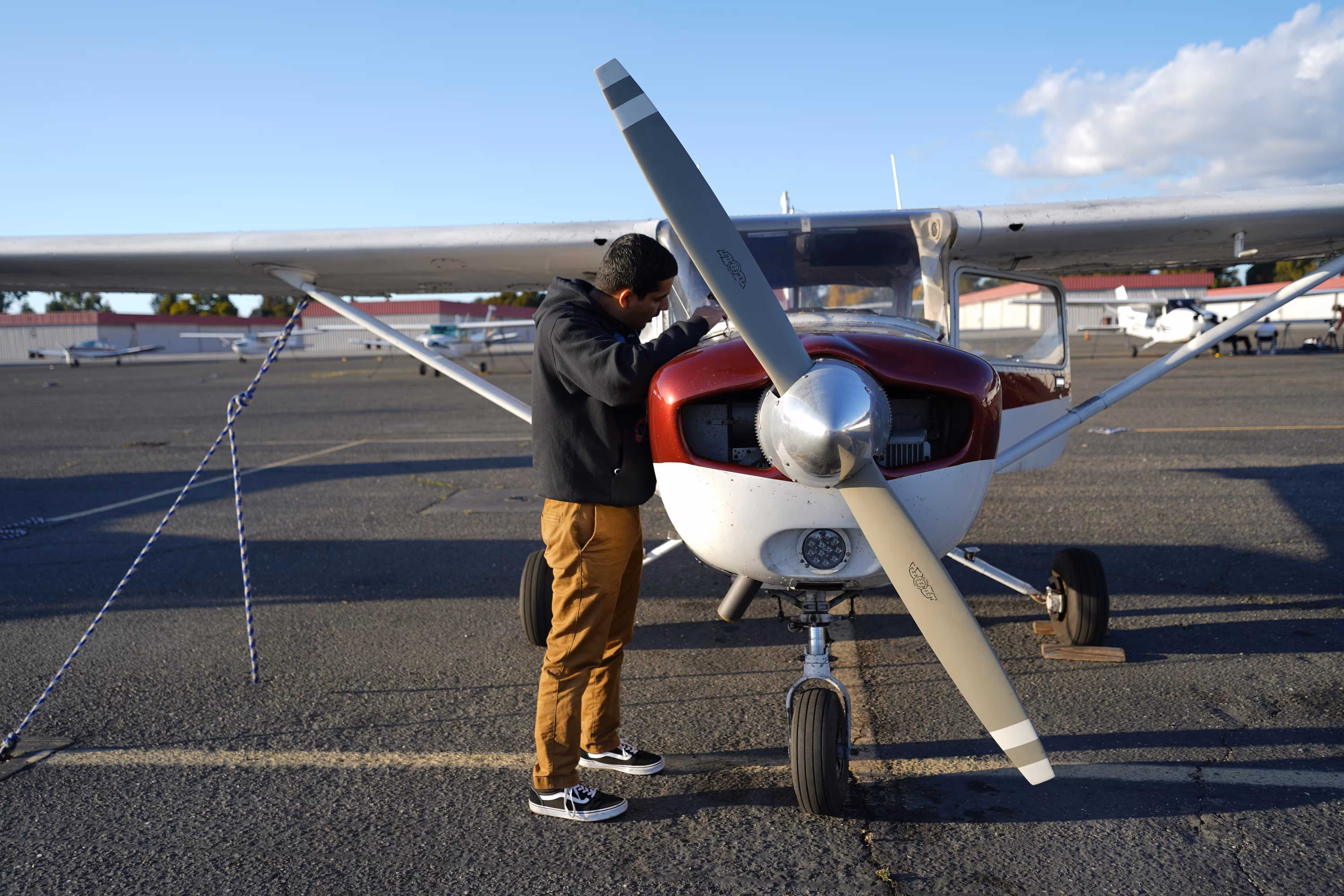 Man carrying out inspection of propeller