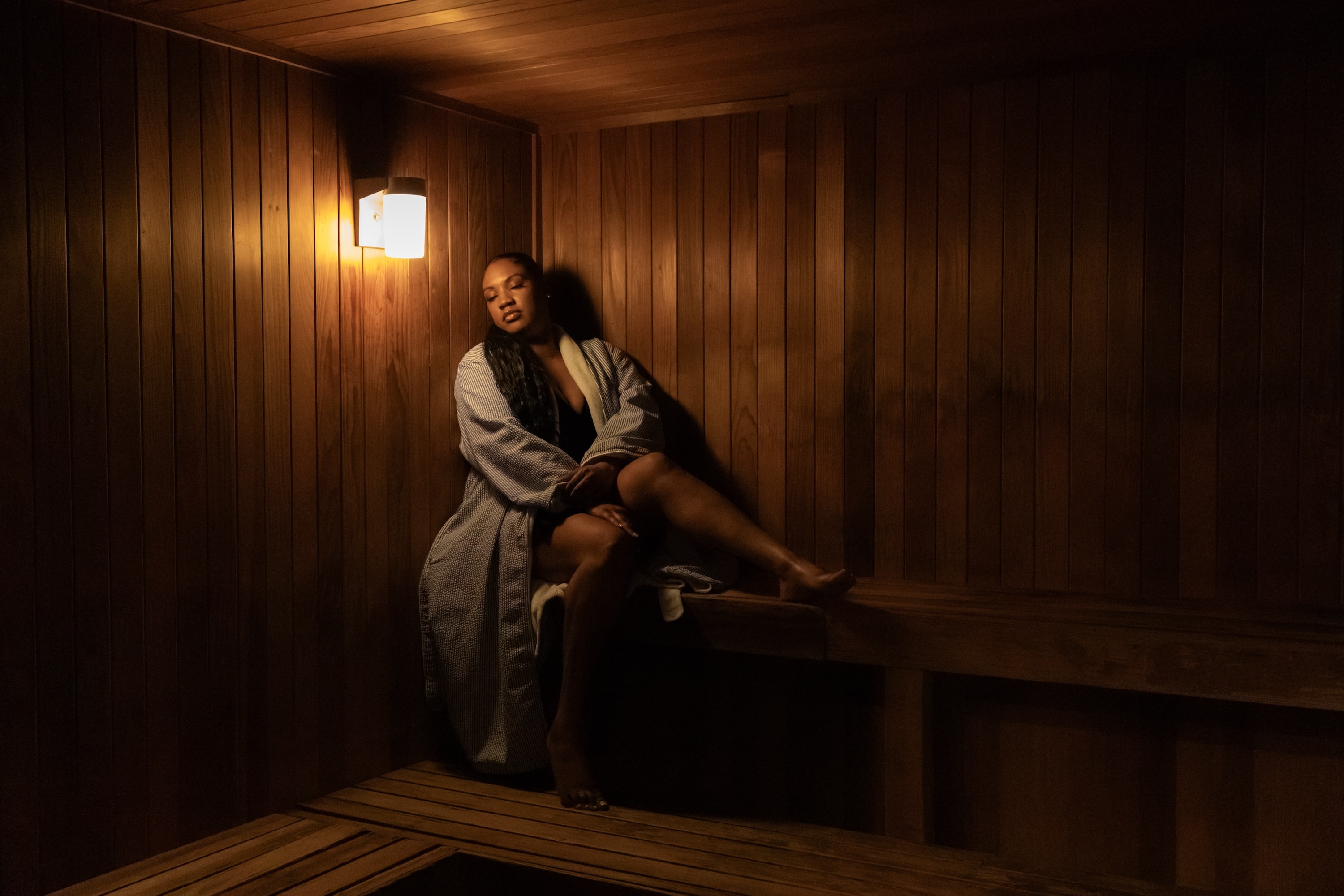 woman relaxing in sauna at Lost Pines Spa