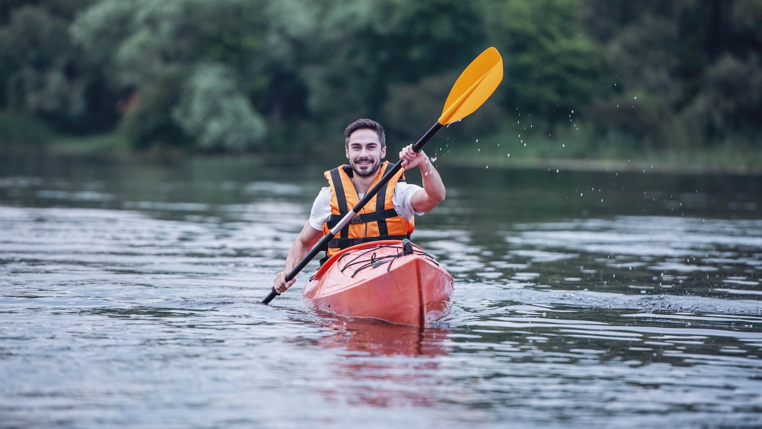 a man kayaking in river near Hyatt Regency Lost Pines