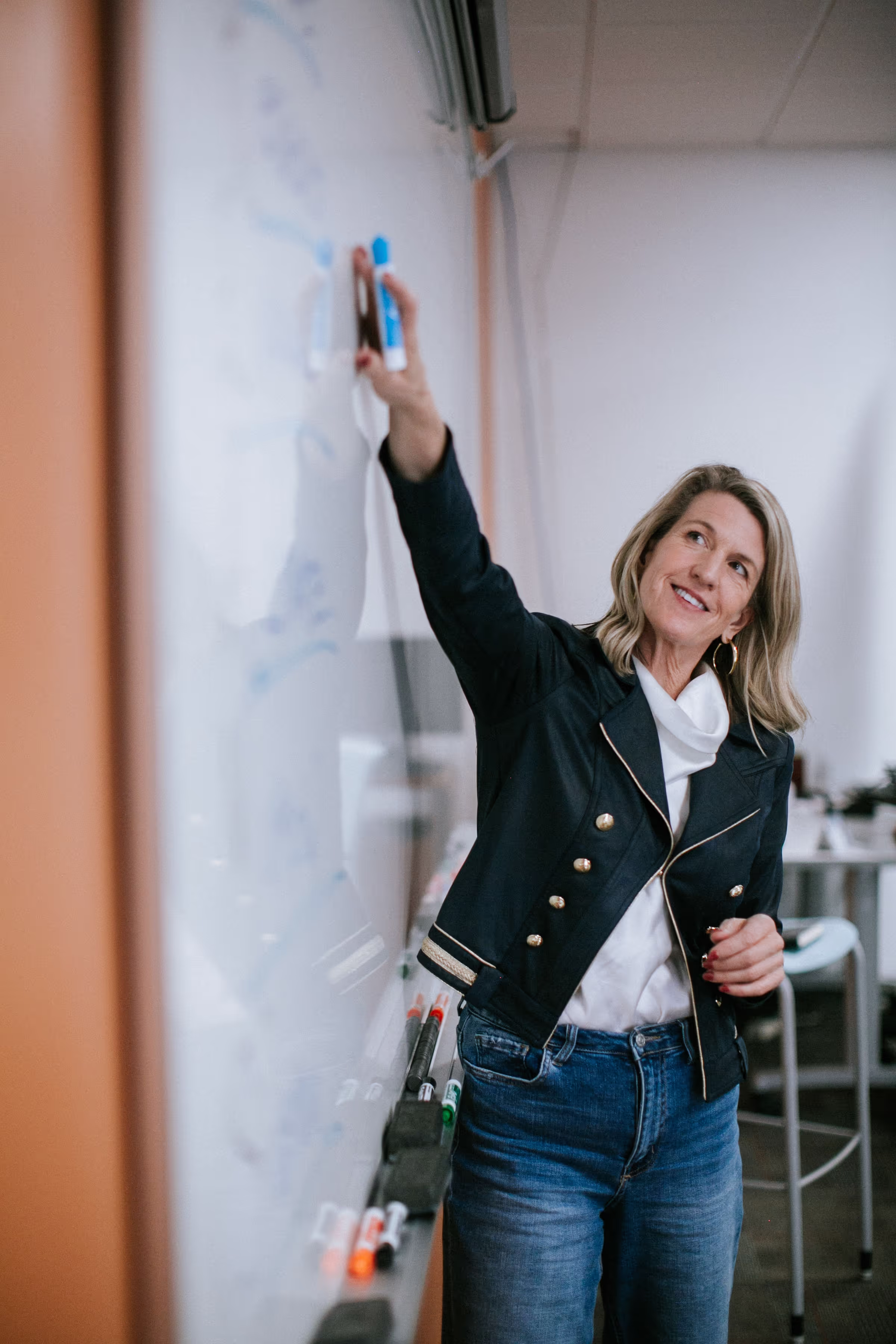 Joanna Hogan teaching at a whiteboard