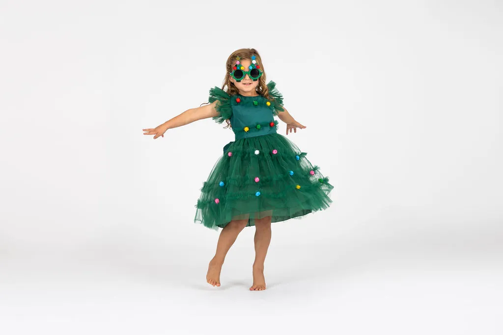 Little Danceology dancer in a green tutu dress twirling with arms out