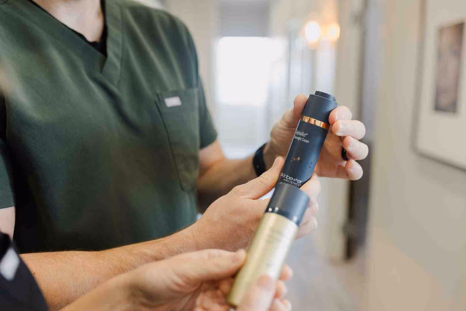 Skincare professional consulting with a client in a clean, modern office - why use medical grade skin care products