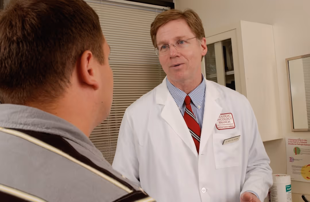 doctor consulting with male patient - getting rid of bags under eyes male