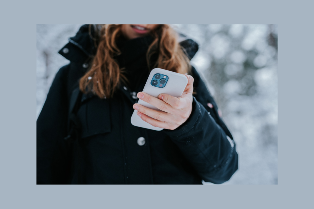 Woman holding an iPhone
