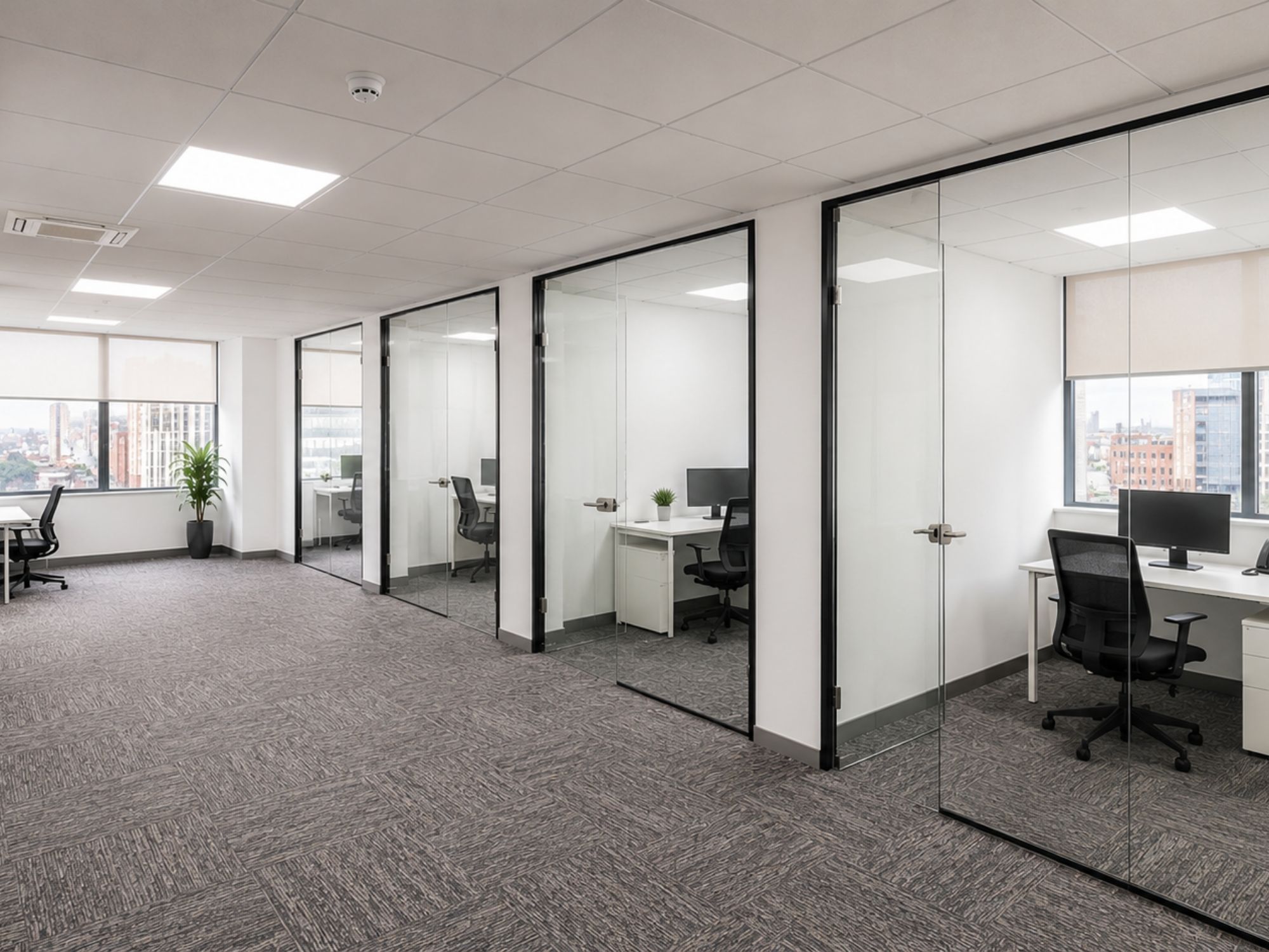 Planned serviced office suites with glass-fronted private offices at St James House in Sheffield