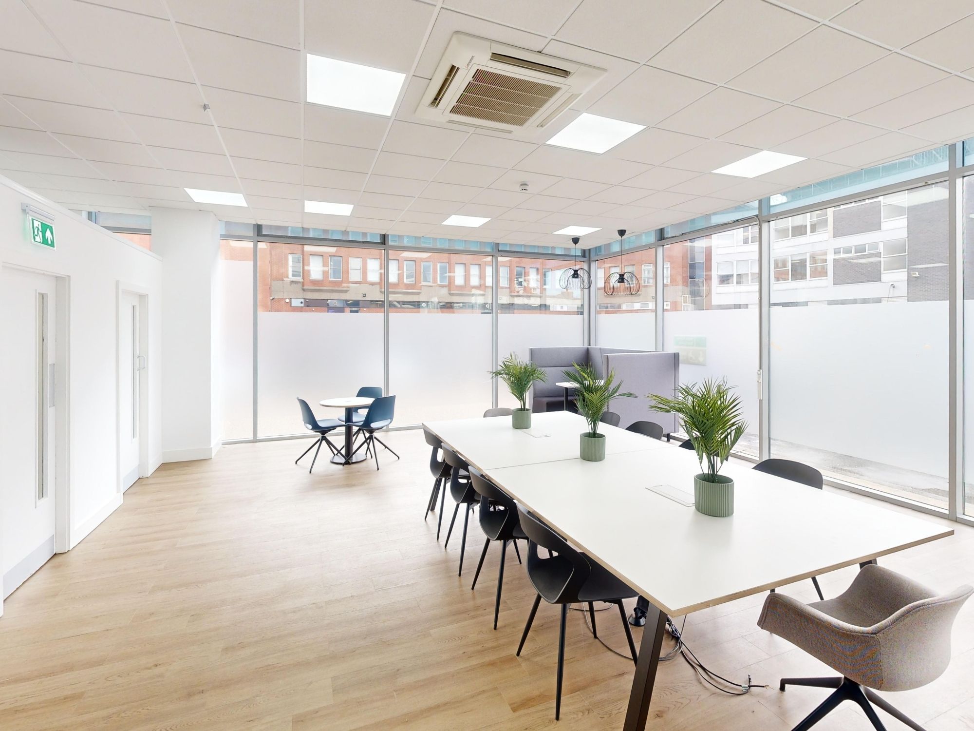 Bright shared workspace and communal seating area at St James House in Sheffield