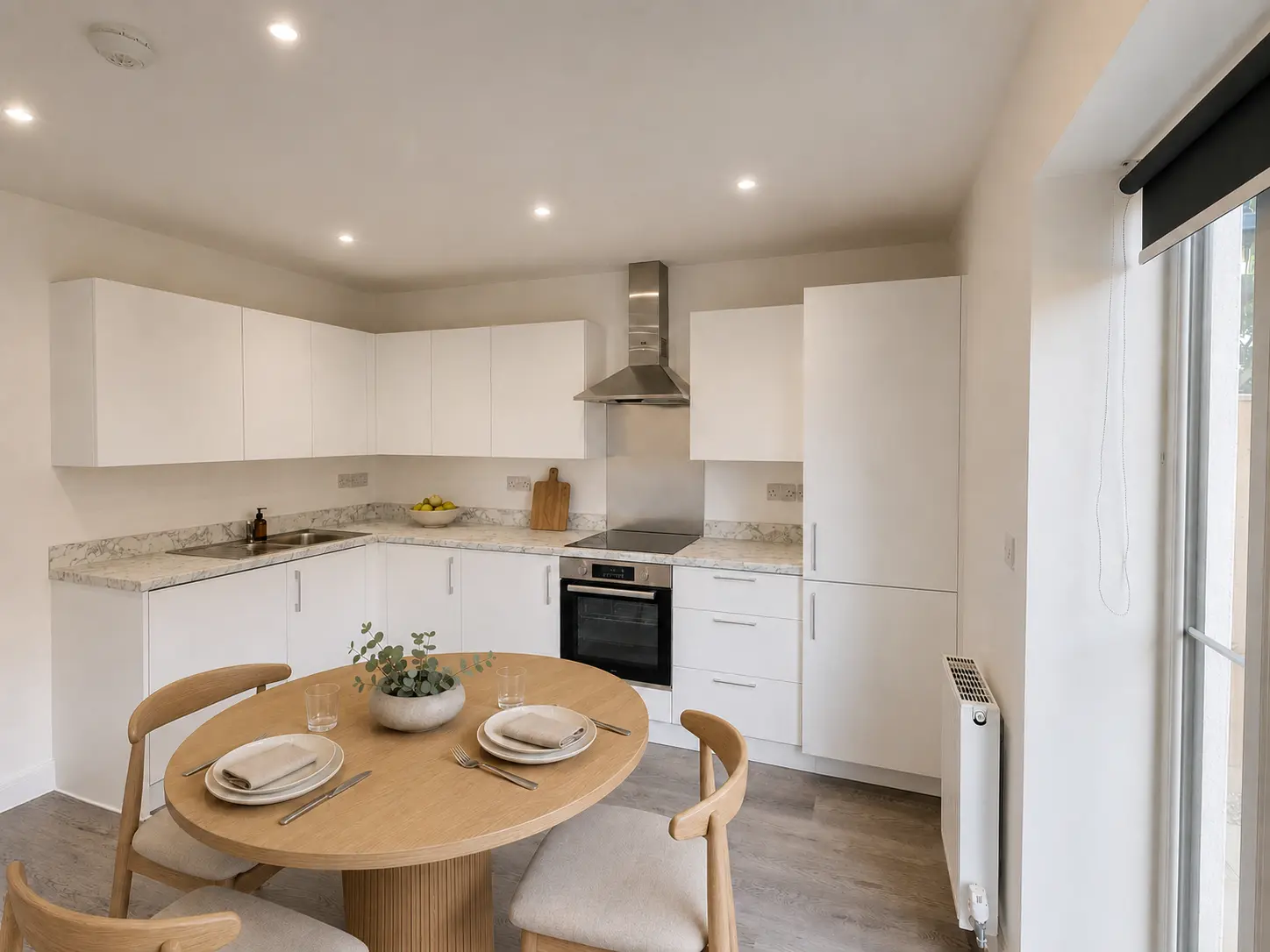 Kitchen and dining area in an Eighth Avenue show home