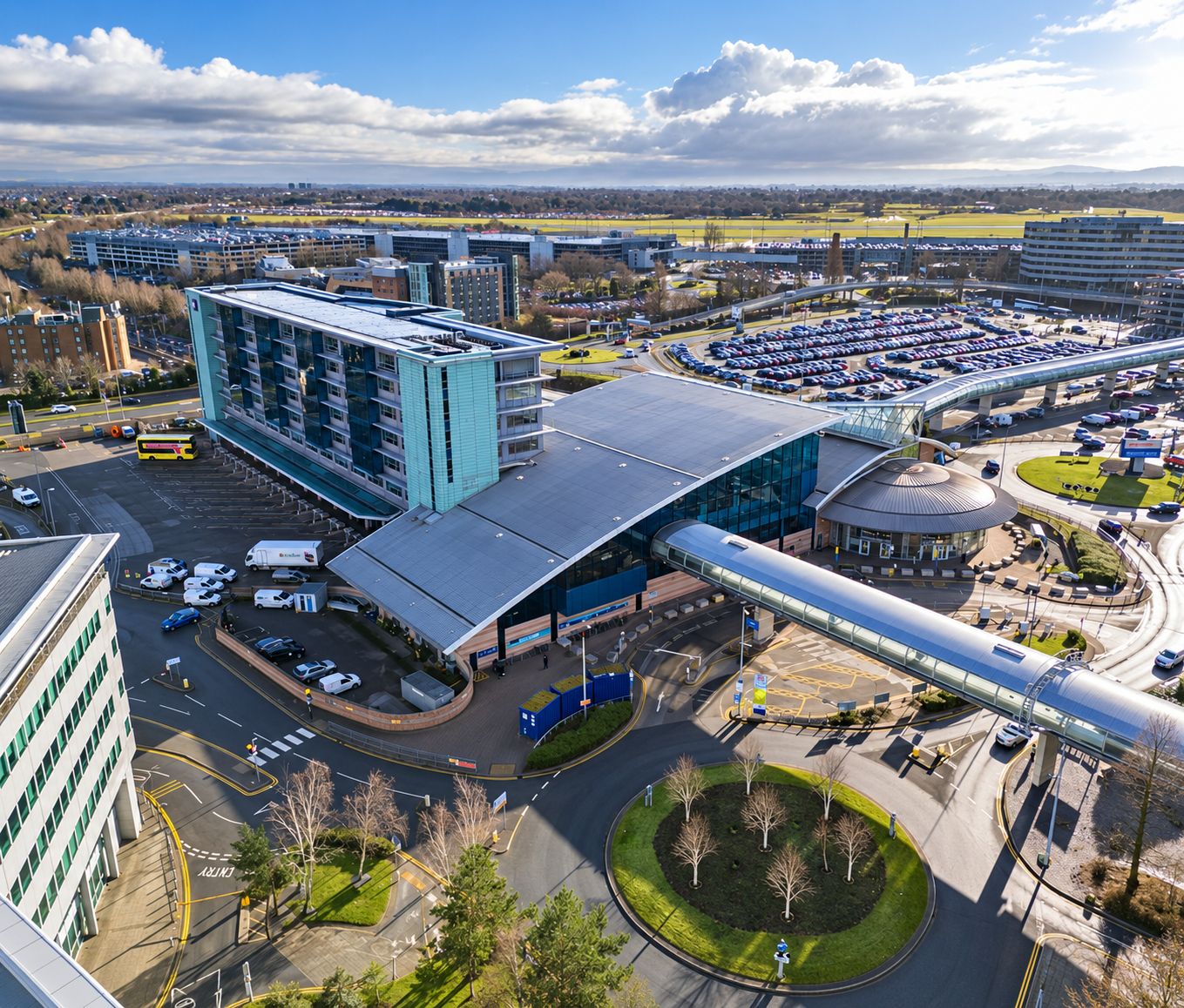 Aerial view of 4M Manchester Airport office building and the surrounding airport transport hub