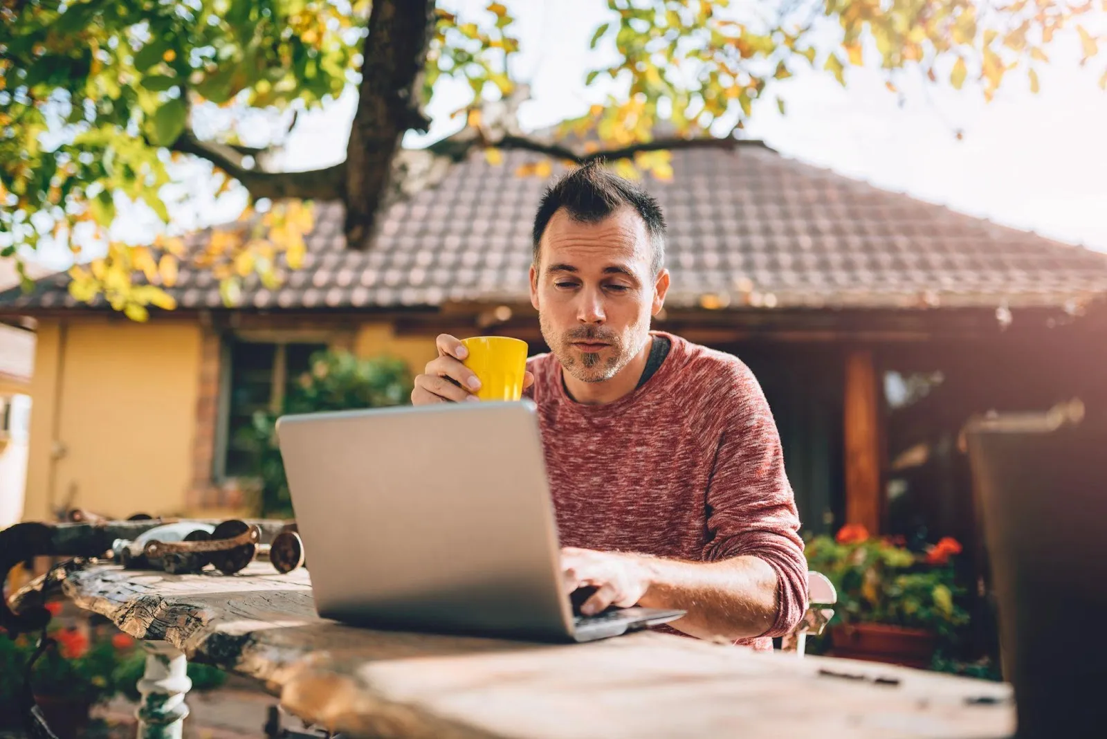Man working online from his backyard