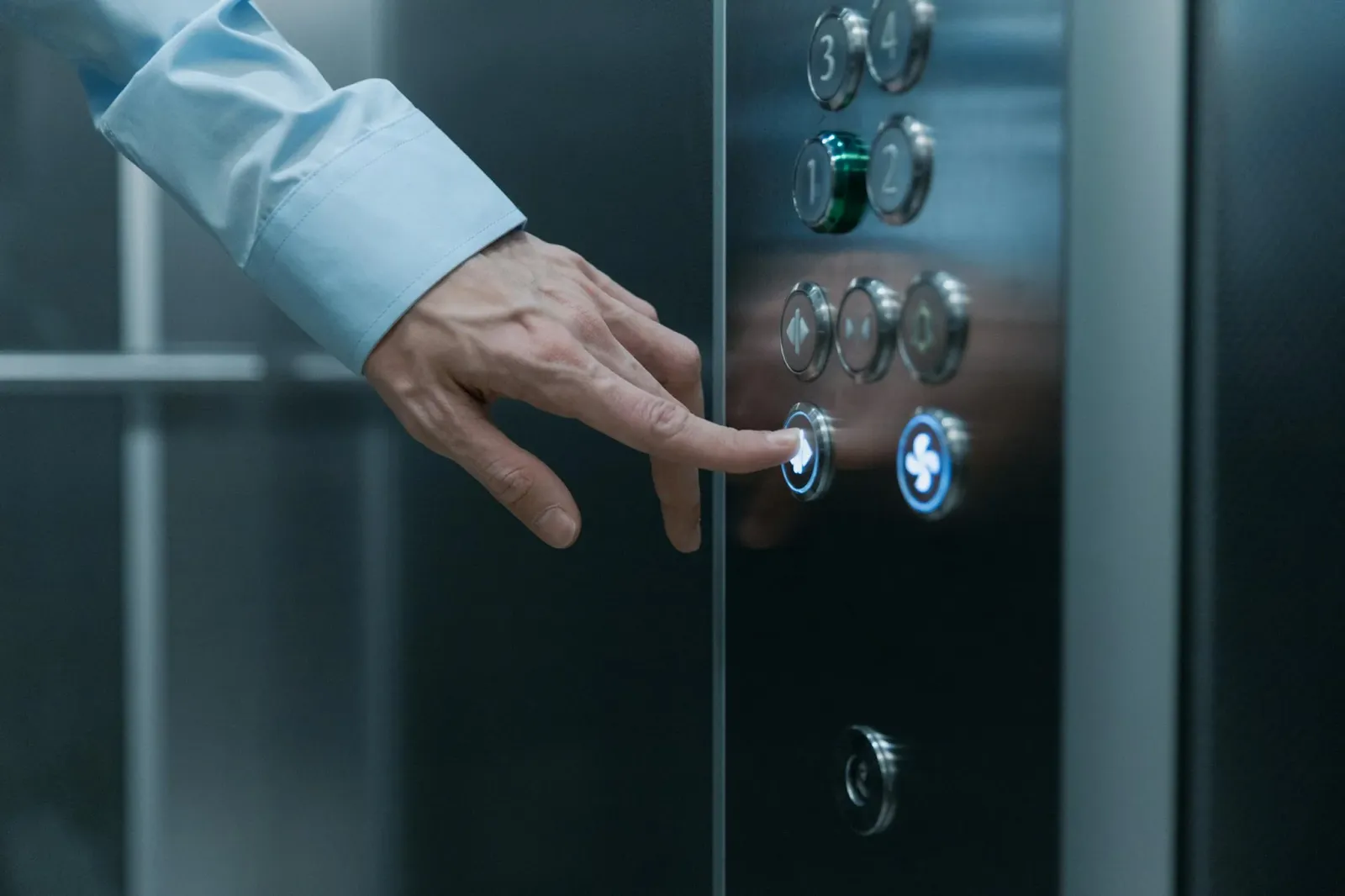 pushing buttons on an elevator