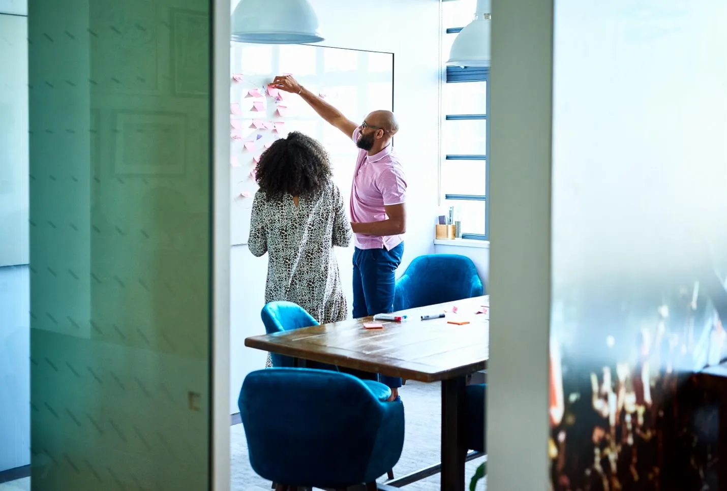 People brainstorming on a whiteboard