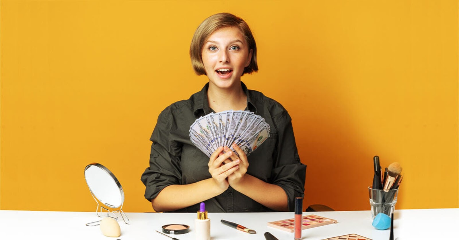 Content creator holding dollar bills