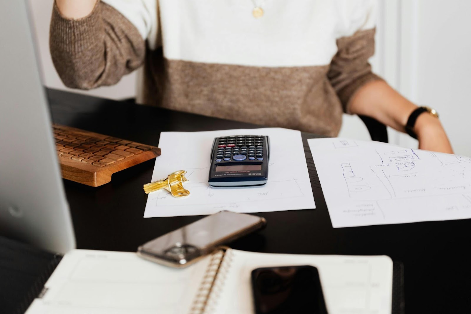 Black calculator on top of paper
