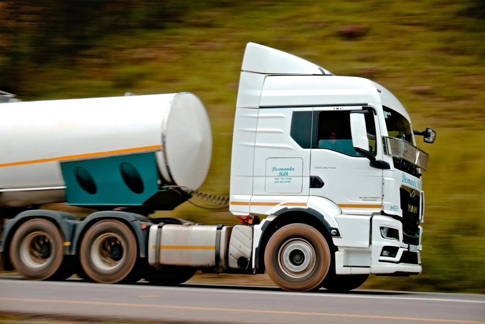 White tank truck on road