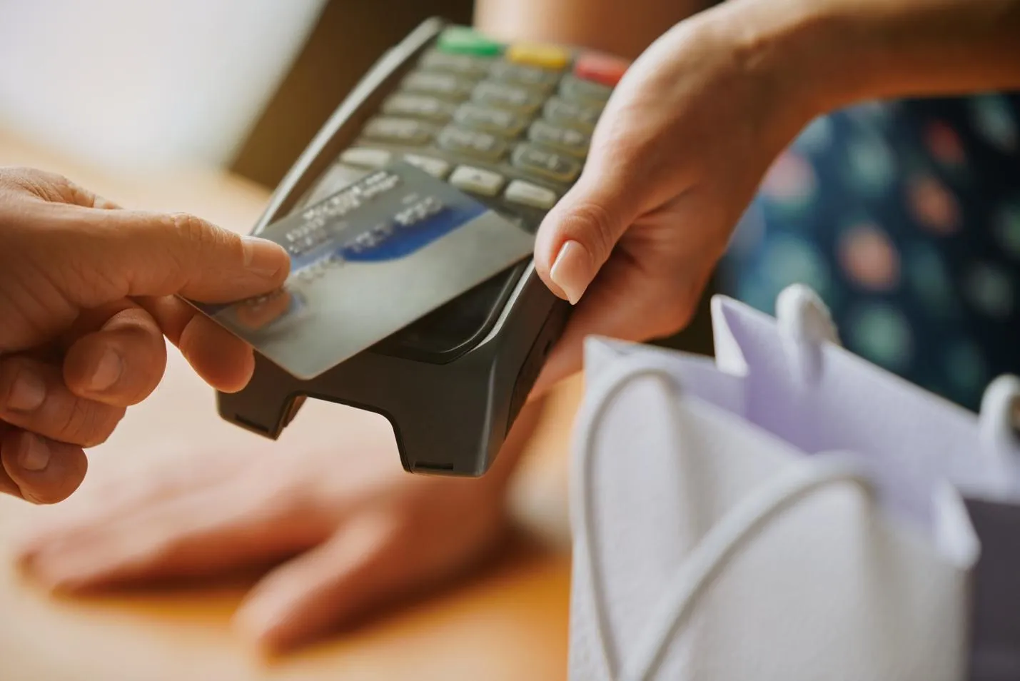 Adult purchasing product with credit card