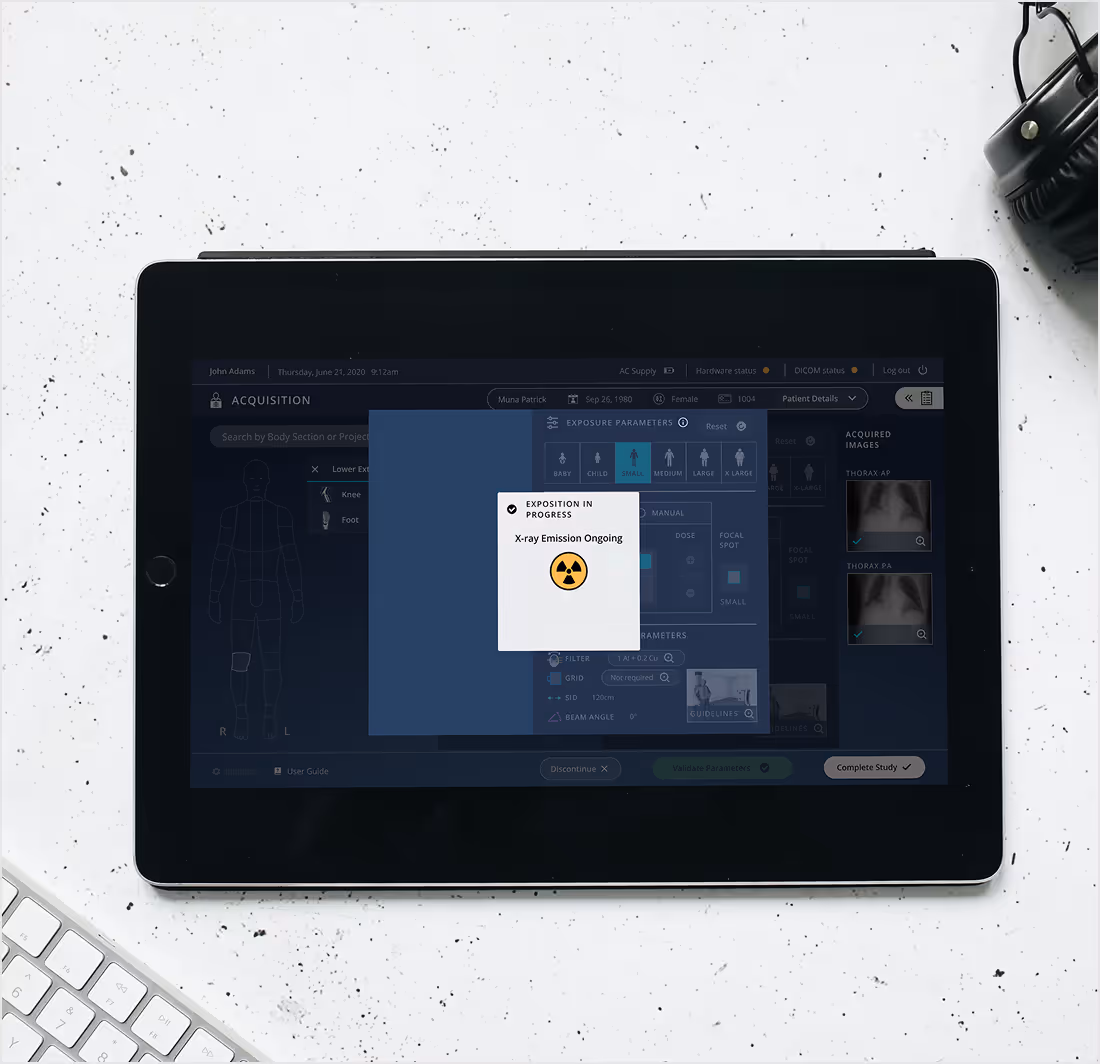 iPad screen with a medical application, loading an x-ray image