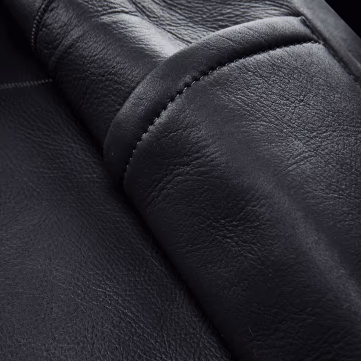 A close up of stretton fox equestrian helmet leather stiching