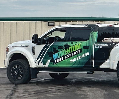 New Vehicle Wrap Design for Momentum Tree Experts by Snyder Advertising