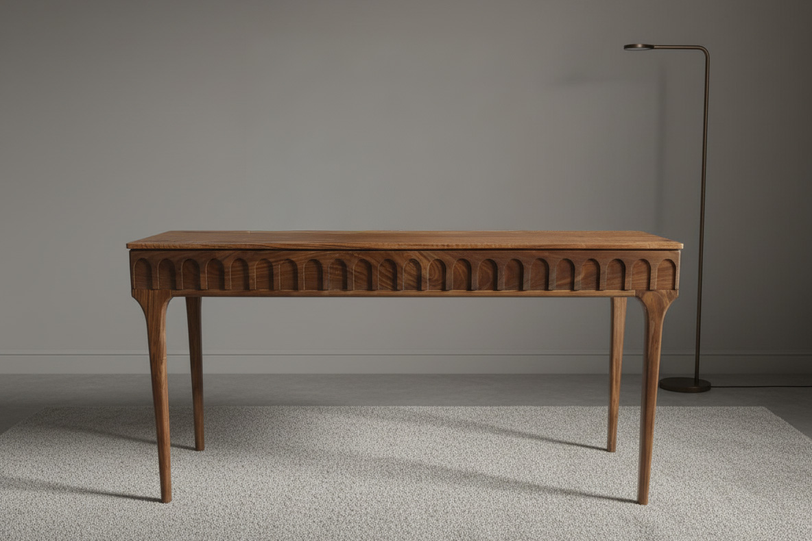 Front view of a handcrafted brutalist-style walnut console table with repeating arch motif.