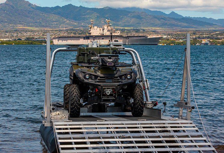 ATV being loaded onto beach from unmanned vehicle 
