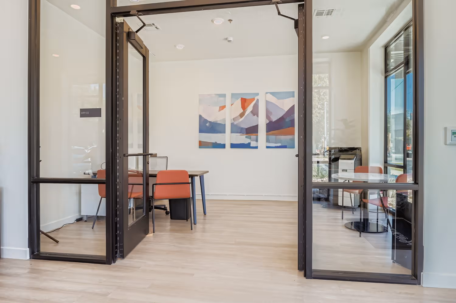 Office of Crossing at 9th apartment complex in Salt Lake City, Utah, showing desks with computers.