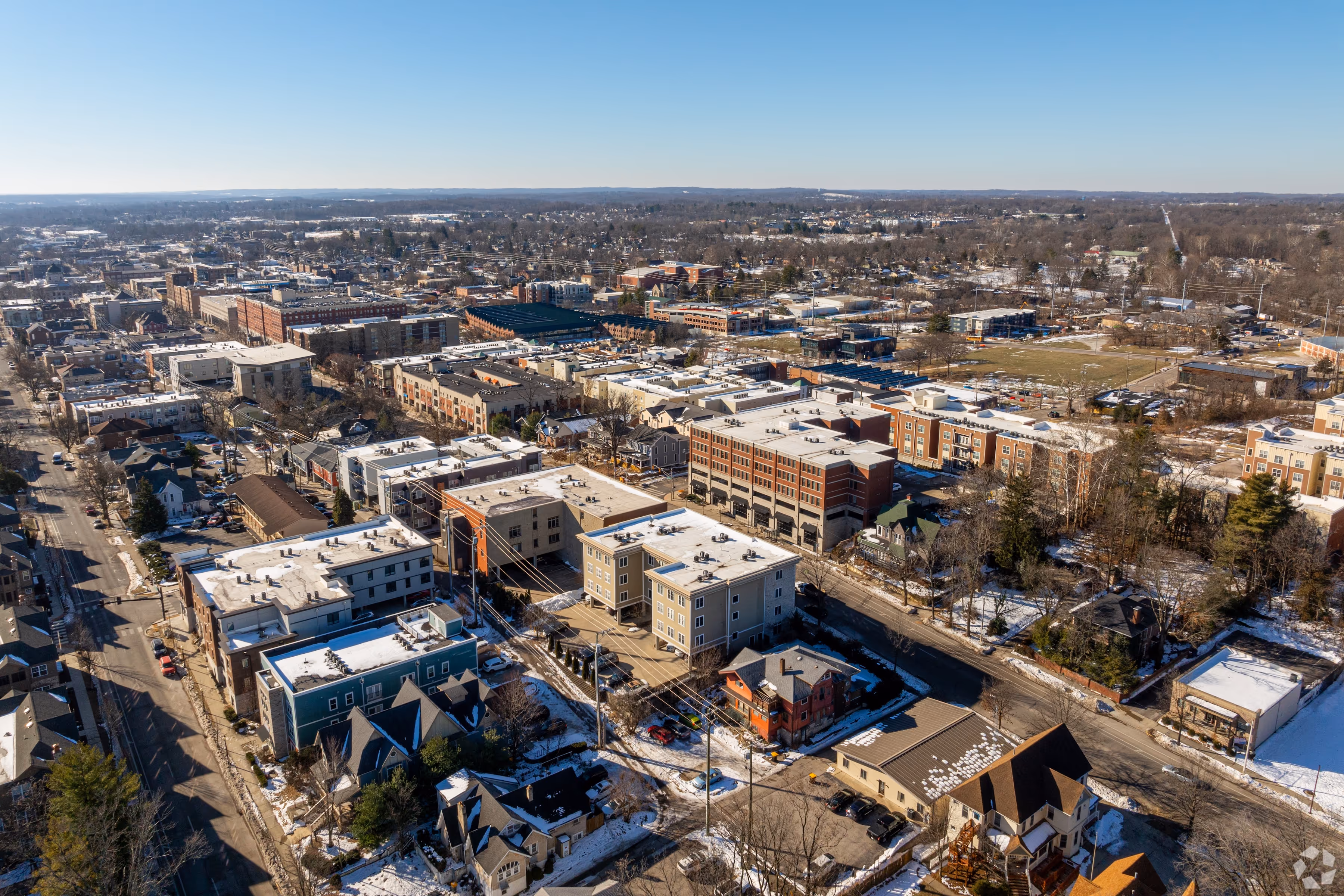 Aerial neighborhood view of 7 Ten apartments in Bloomington, Indiana, showing proximity to local transit and downtown area.
