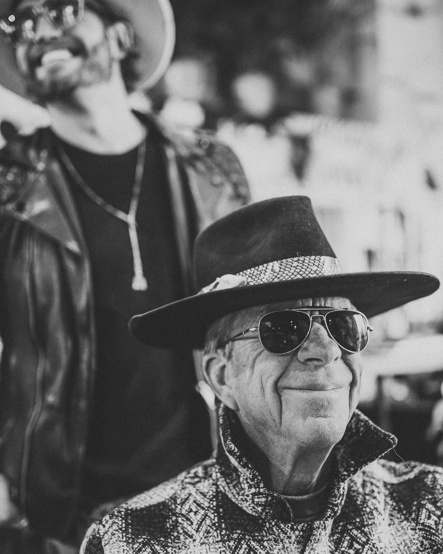 A male model poses with a Trovador Customs hat.