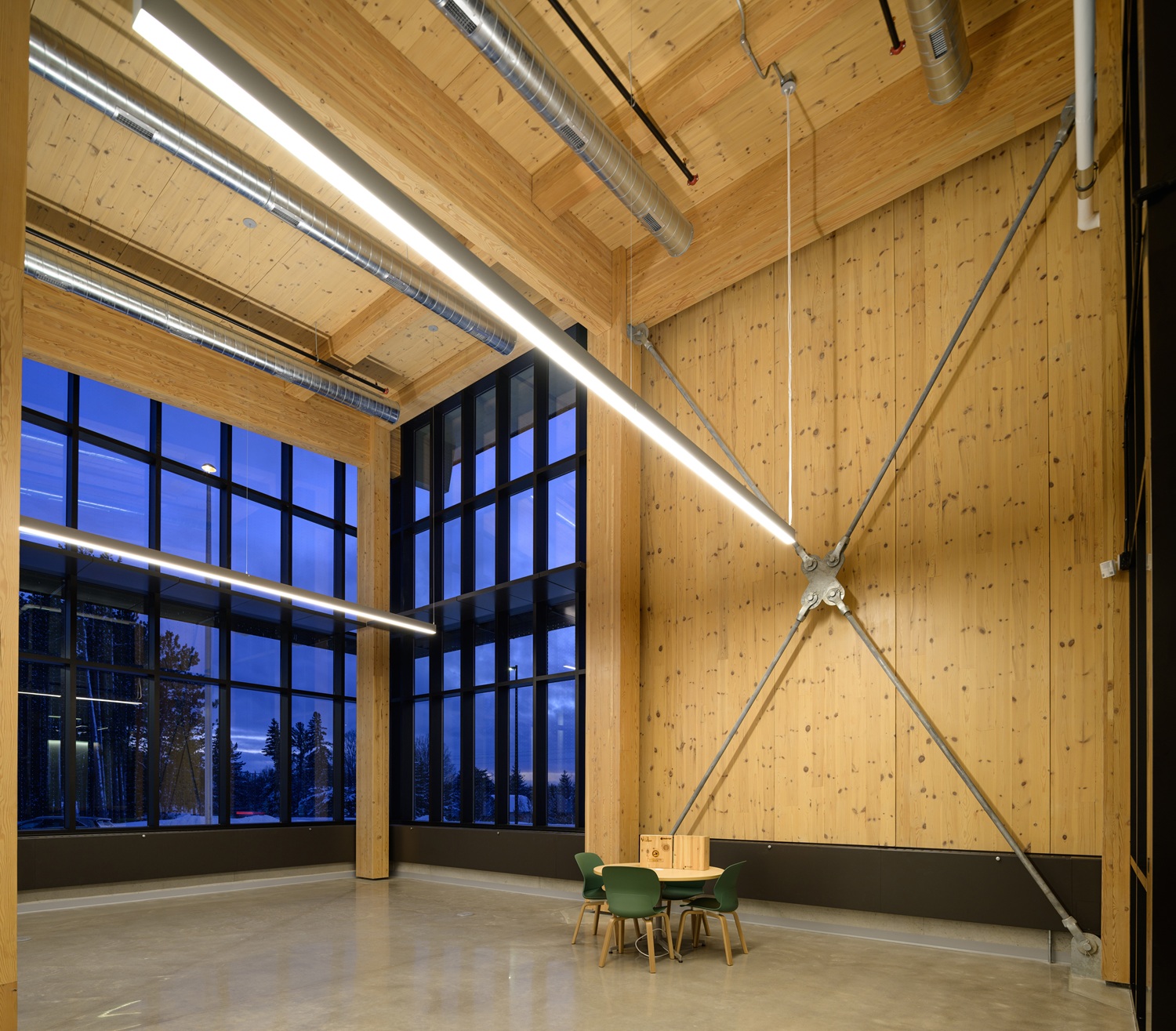 Exposed mass timber cross laminated (CLT) shear walls inside the building from floor to ceiling.